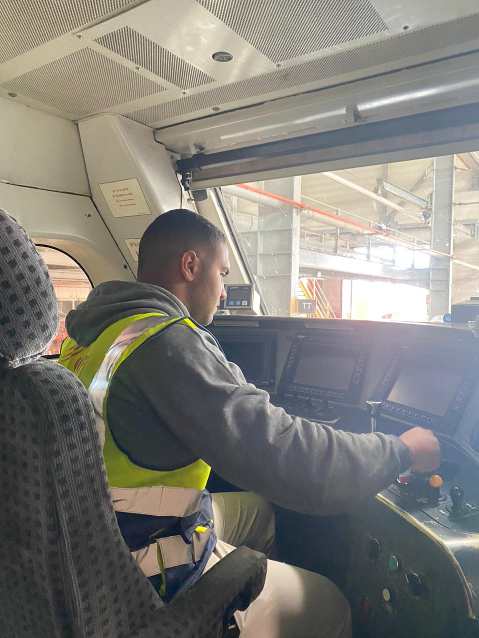 Oussama at train controls